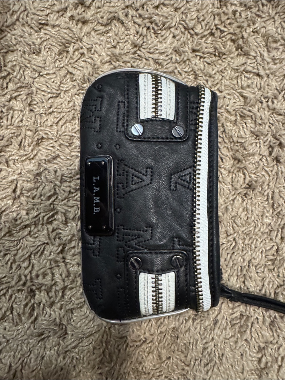 L.A.M.B. Black Wristlet with White Trim and Metal Plate